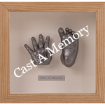 Baby hand and foot casting in a wooden frame