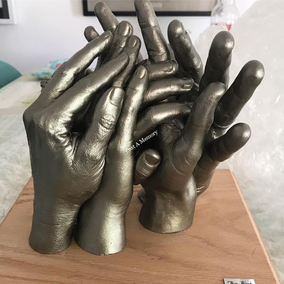 Family of five hand casts on mount