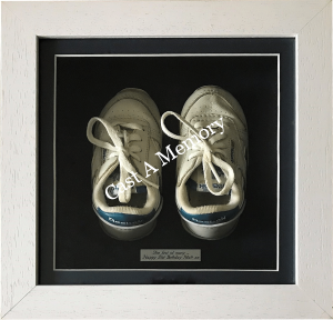 Baby's trainers in box frame