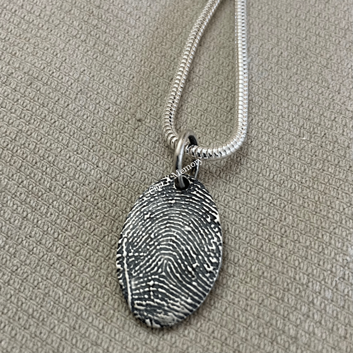 Large oval silver charm with fingerprint on chain
