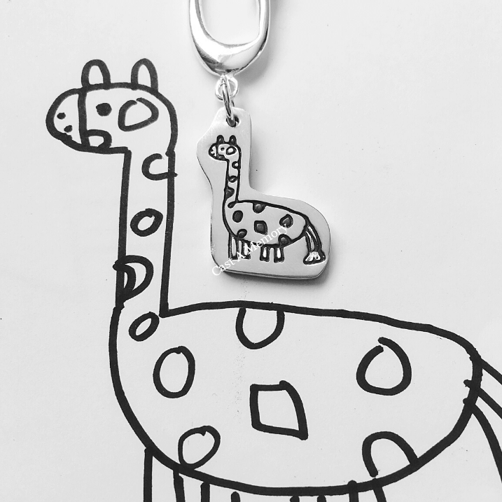 Giraffe drawing inscribed on silver pendant on keyring