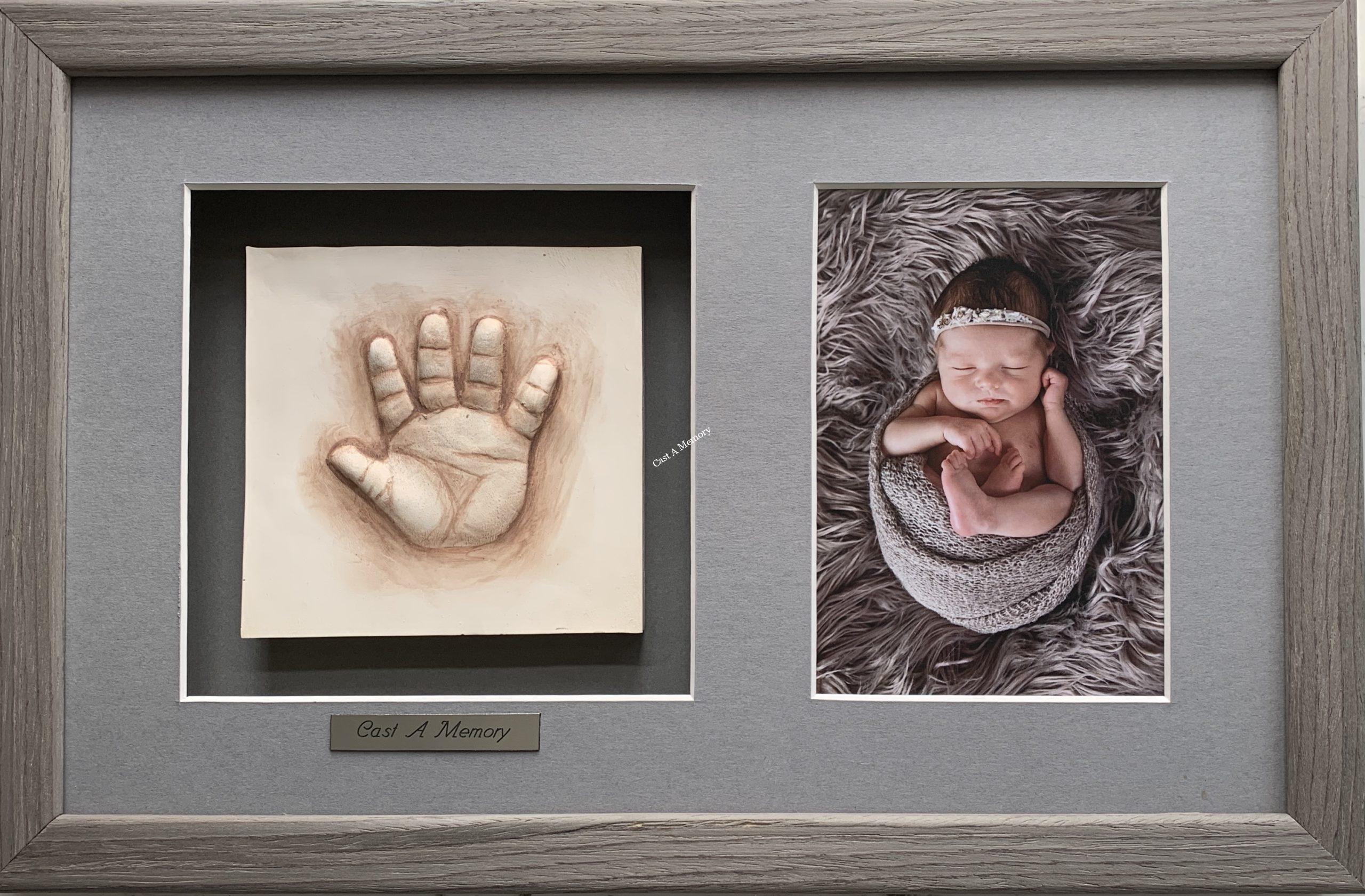 baby clay hand impression with photograph in wooden frame