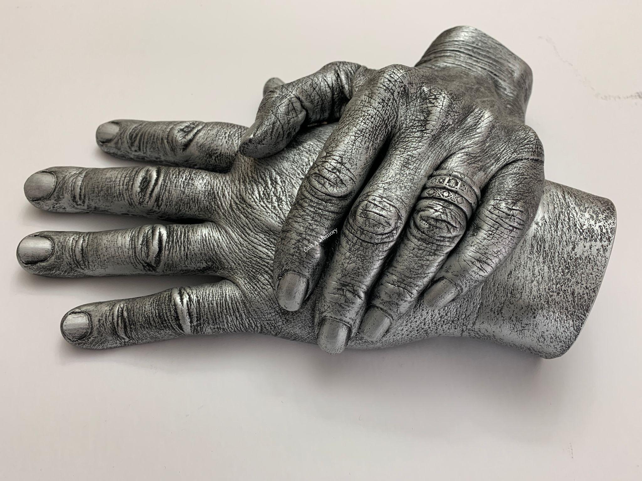 two hands together in cast