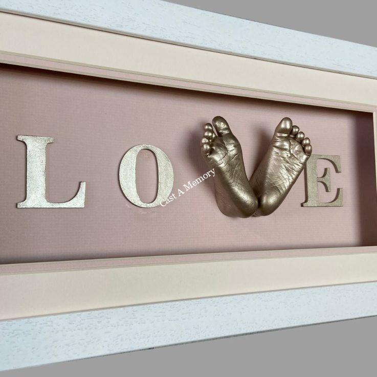 framed baby love cast with two feet in gold