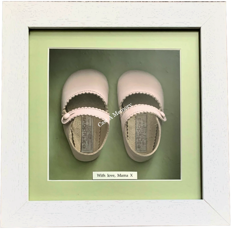 specialist framing of Pink first baby shoes in box frame