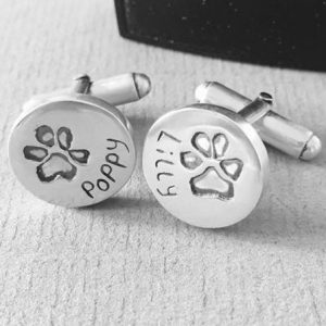 paw prints impressions stamped onto silver cuff links