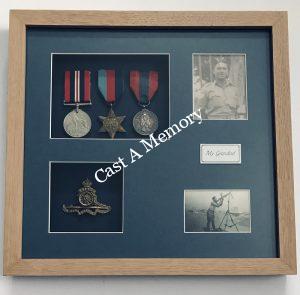 war medals and photographs framed in a specialist oak frame